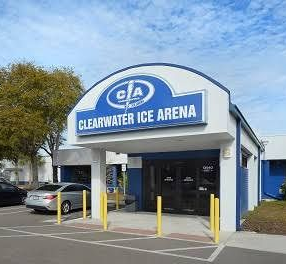 Ice center building exterior with blue logo, green windows, and address 3173