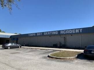 Ice center building exterior with blue logo, green windows, and address 3173