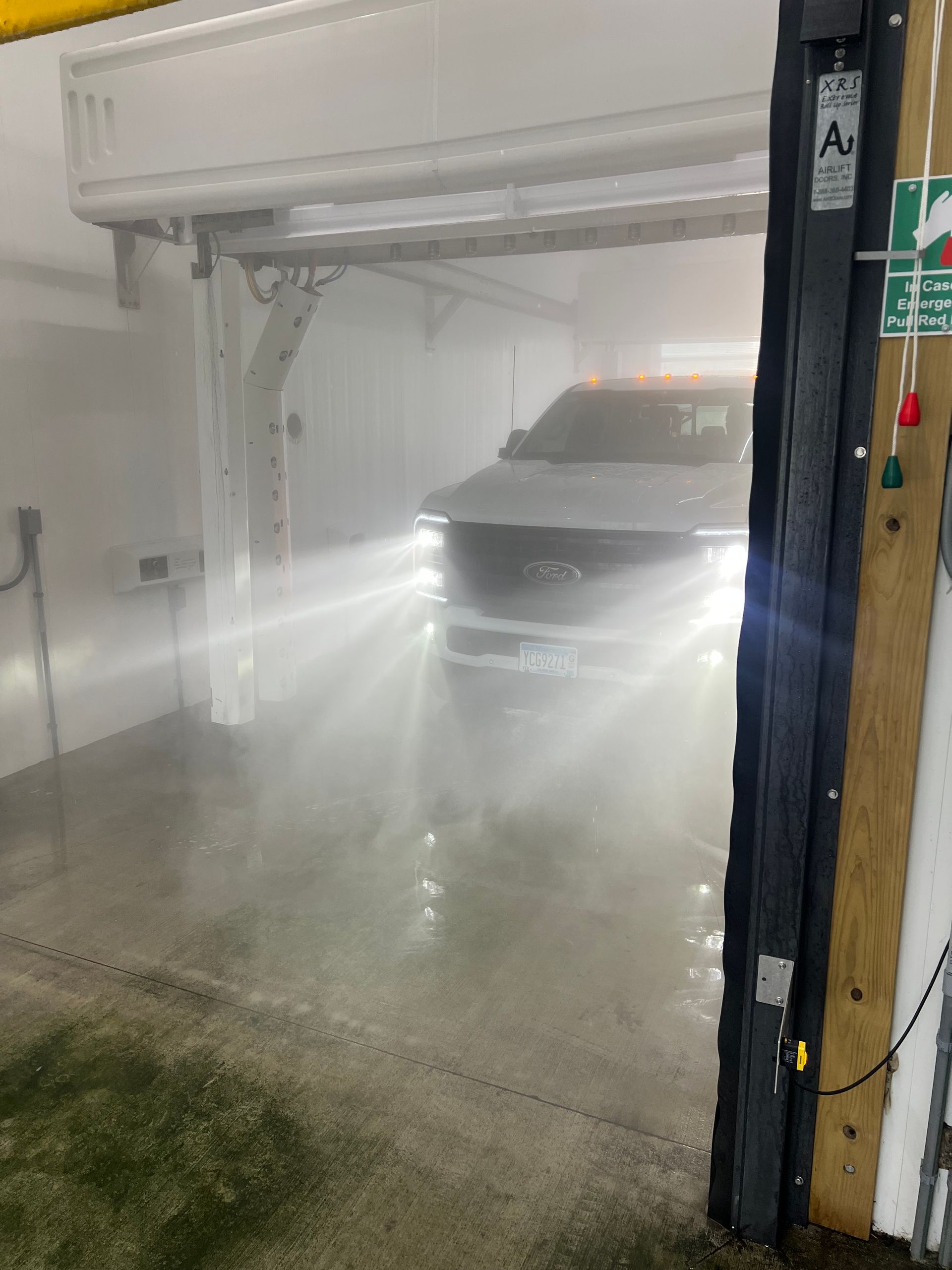 A car is driving through a car wash in the fog. | Duffy's Auto Service