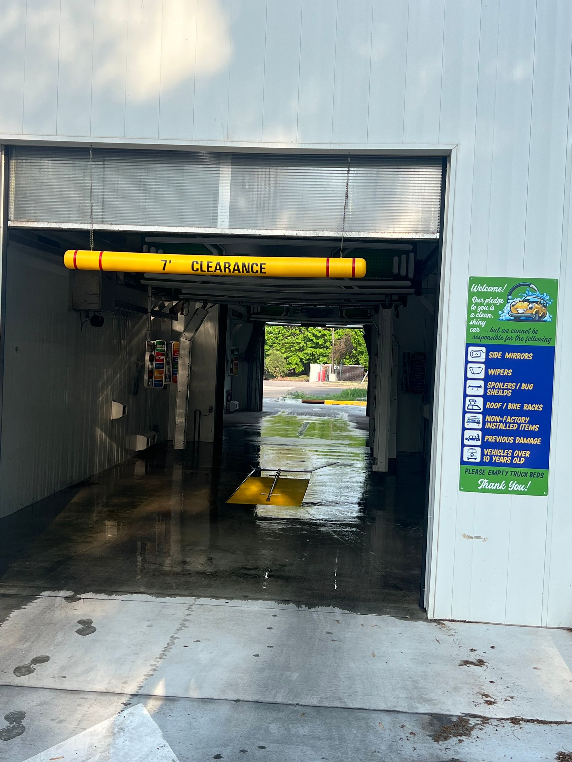 A car wash with a sign on the wall that says surface | Duffy's Auto Service
