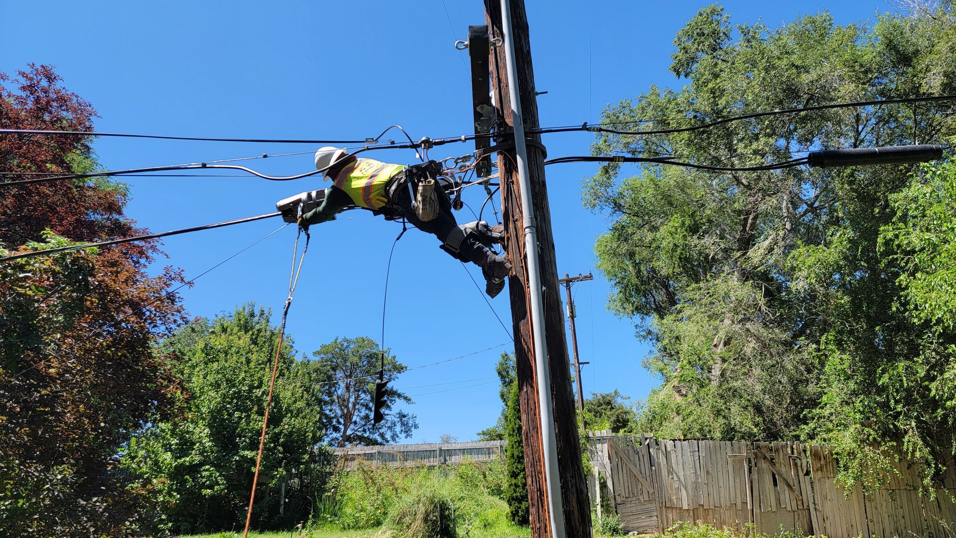 Pole inspection crew ensuring compliance with safety regulations in Oregon