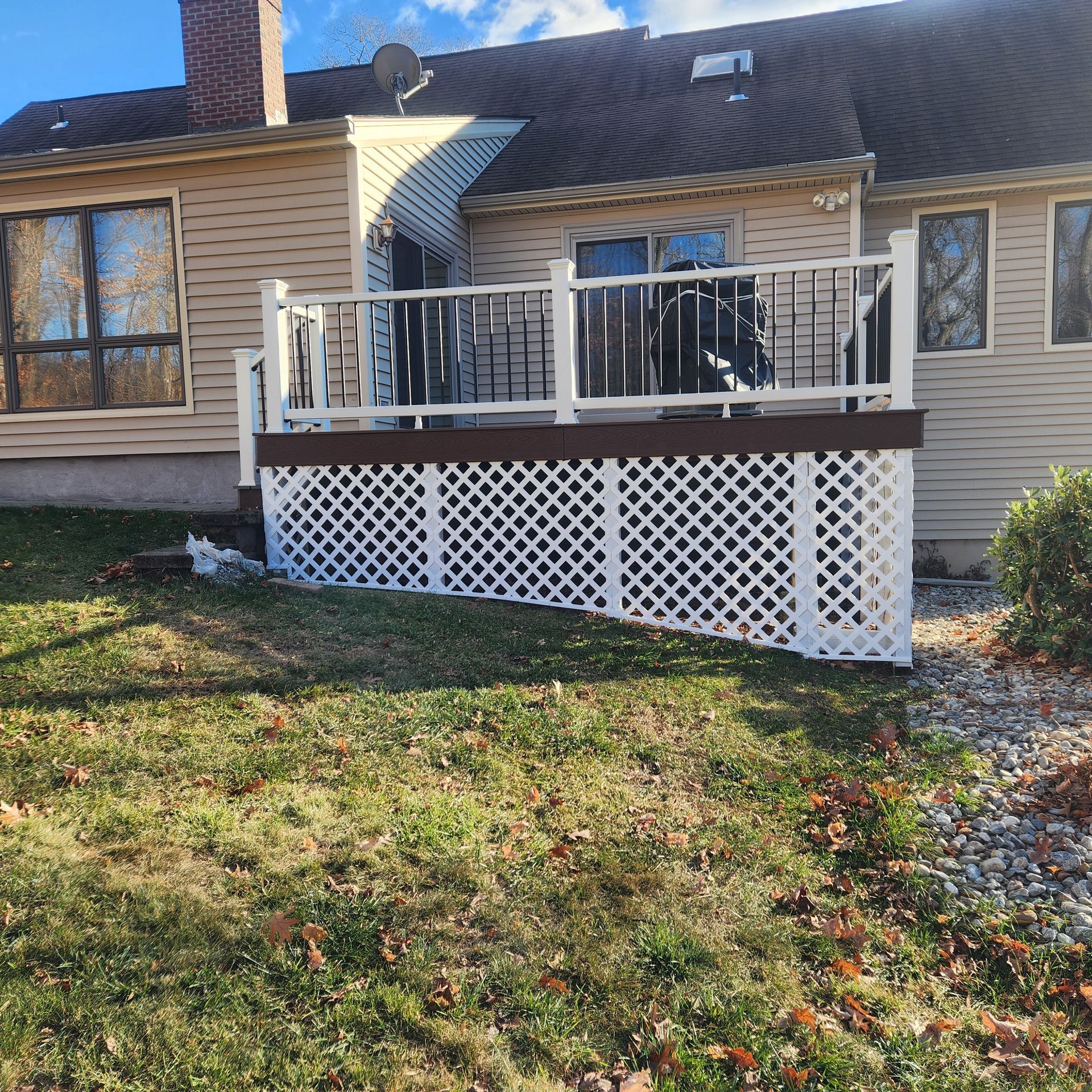 A finished deck construction and installation​ in Glastonbury CT by Exteriors of CT