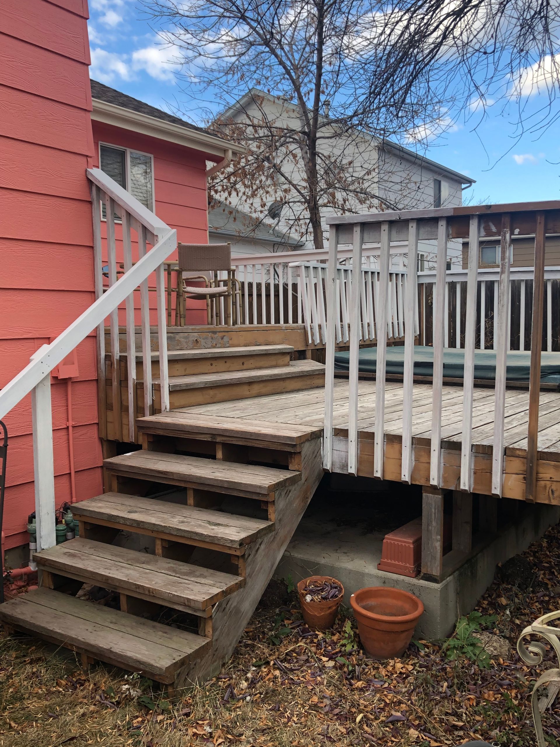 A Wooden Deck With Stairs Leading Up To It