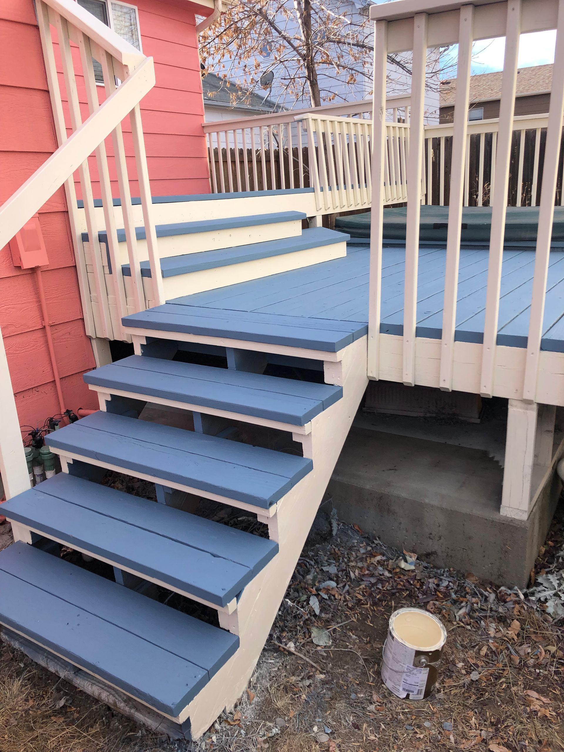 The Stairs Are Painted Blue And White And The Deck Is Painted Blue And White