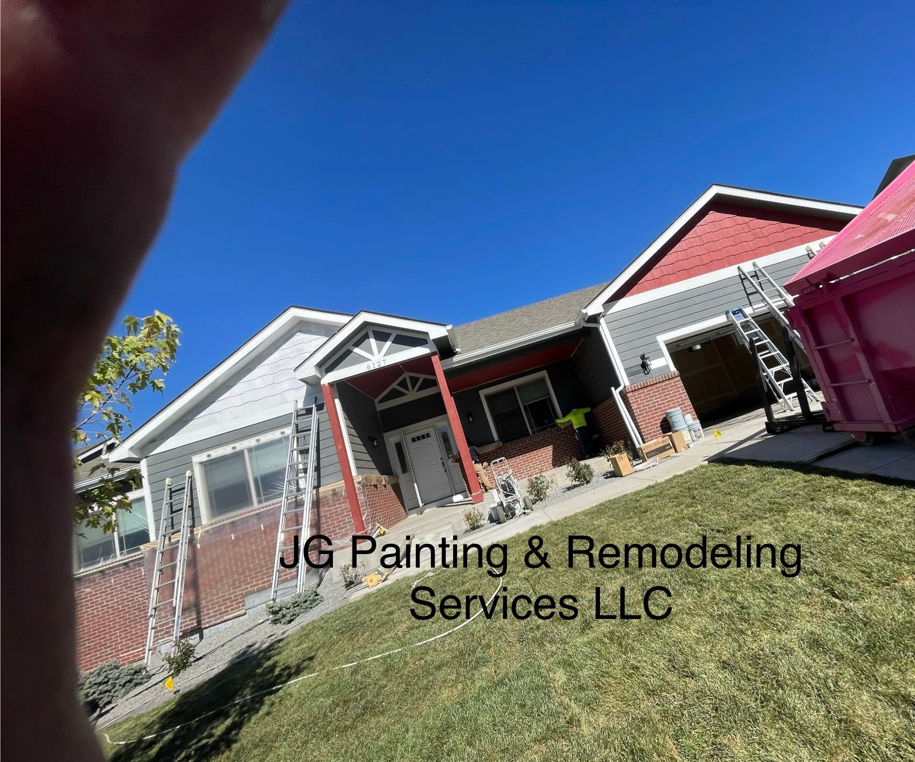 A House Is Being Painted By Jg Painting & Remodeling Services Llc