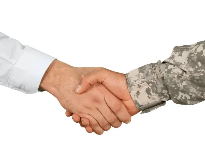 Veteran shaking mortgage lenders hand