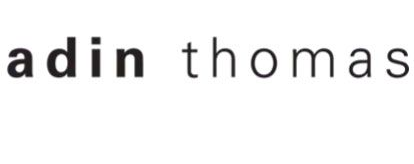 Logo reading “adin thomas” in black lowercase text on a white background