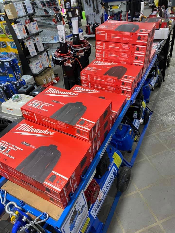 Blue Carts Loaded With Red Milwaukee Tool Boxes in a Store