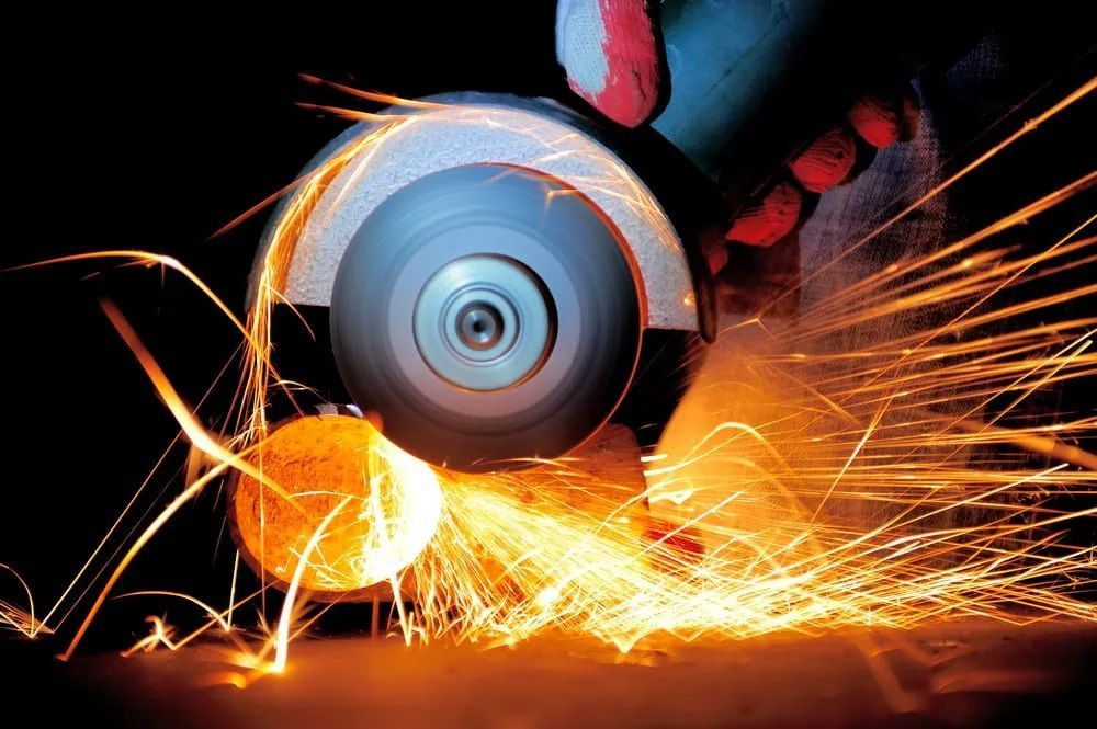 Worker Cutting Metal With Grinder — Bearfast Bearquip In Taminda NSW