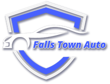 Logo for Falls Town Auto: a blue and white shield shape with a stylized car silhouette.