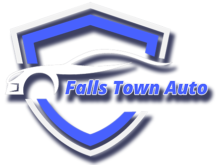 Logo for Falls Town Auto: white car silhouette, blue and white shield, and text
