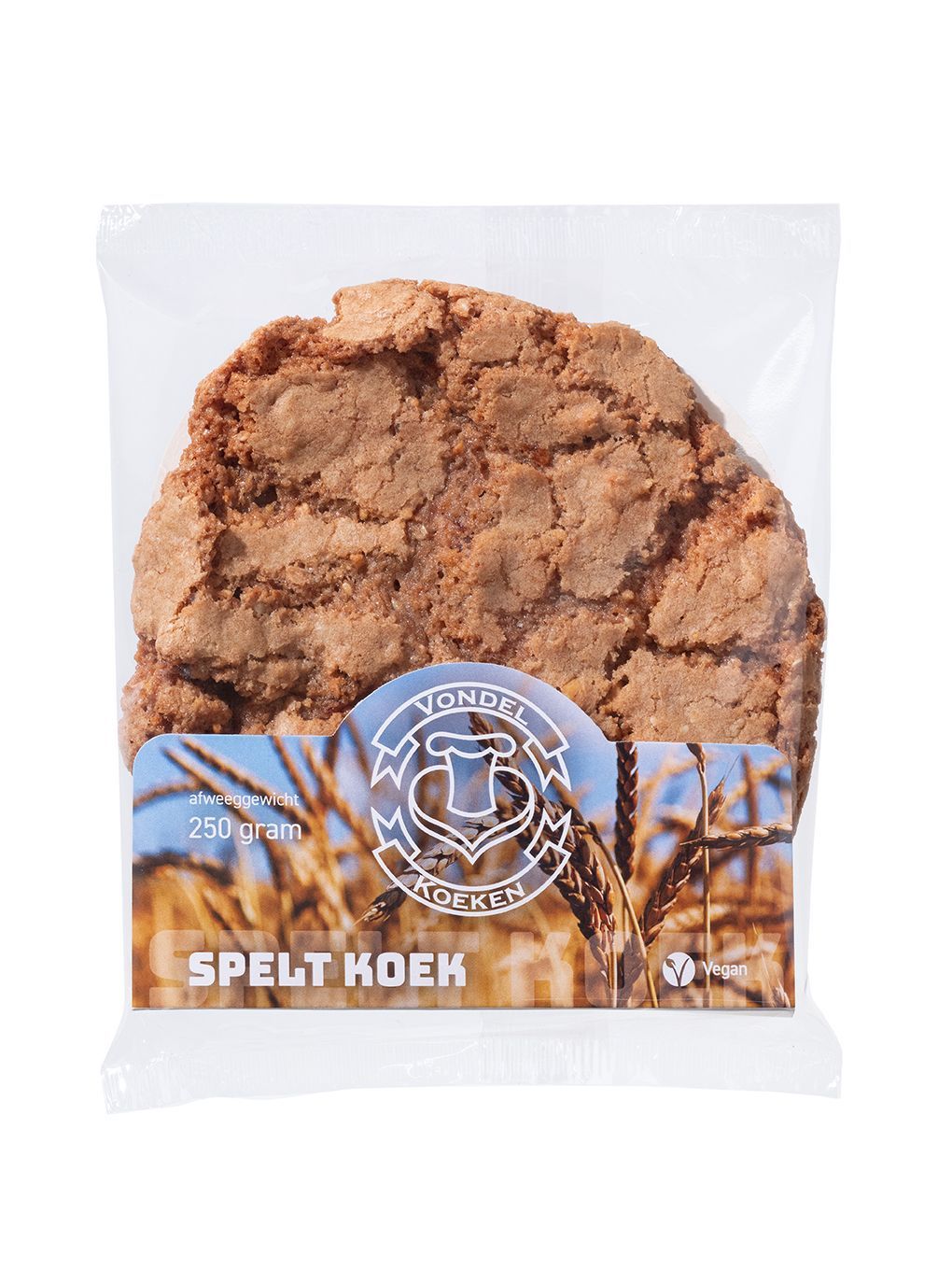 Verpakte speltkoek in een transparante verpakking met blauw etiket en een zichtbaar bruin koekje.