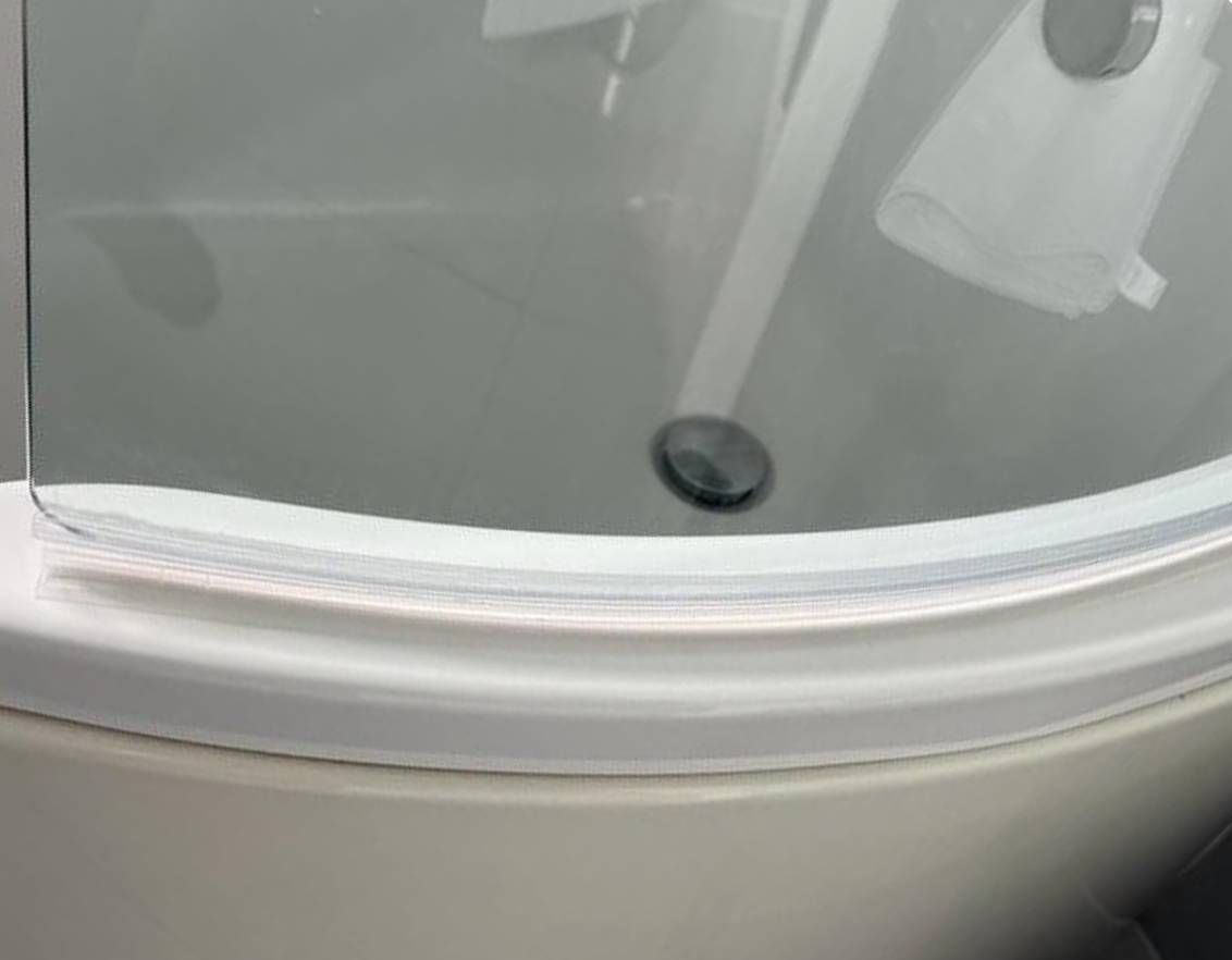 Squeaky Cleaners nottingham after cleaning out the hard scale and mould from the bottom of a shower screen