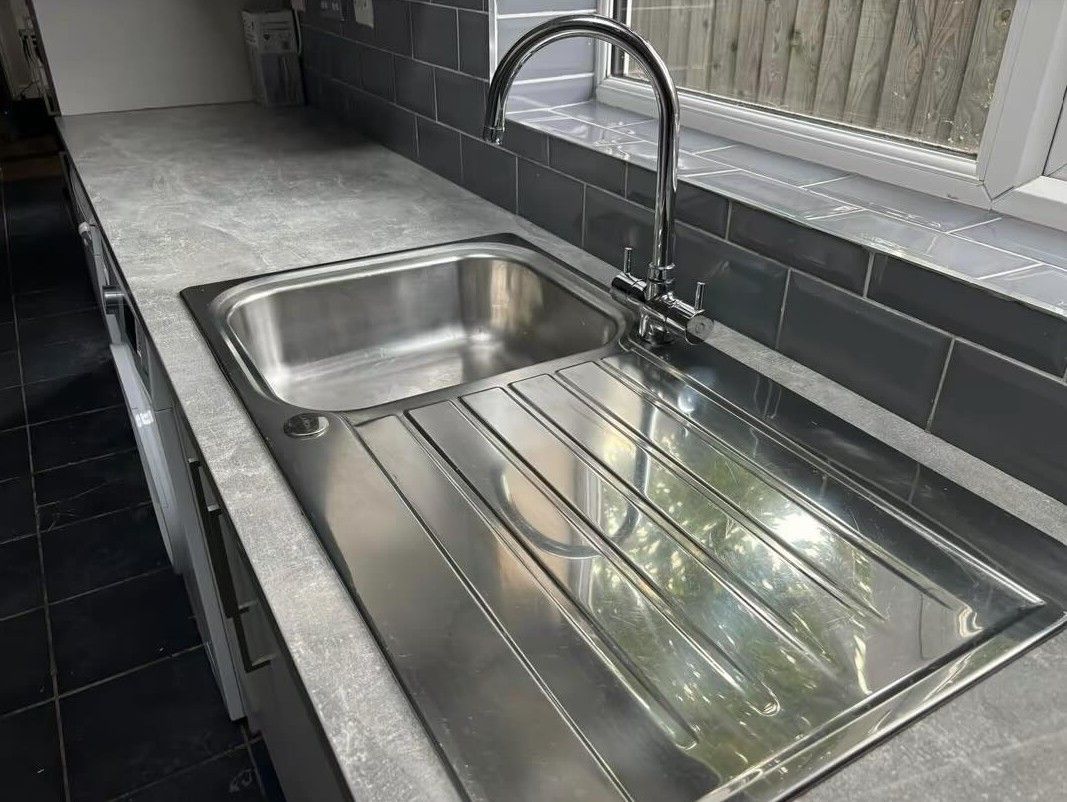 Squeaky Cleaners Nottingham after cleaning a kitchen sink in Hoveringham