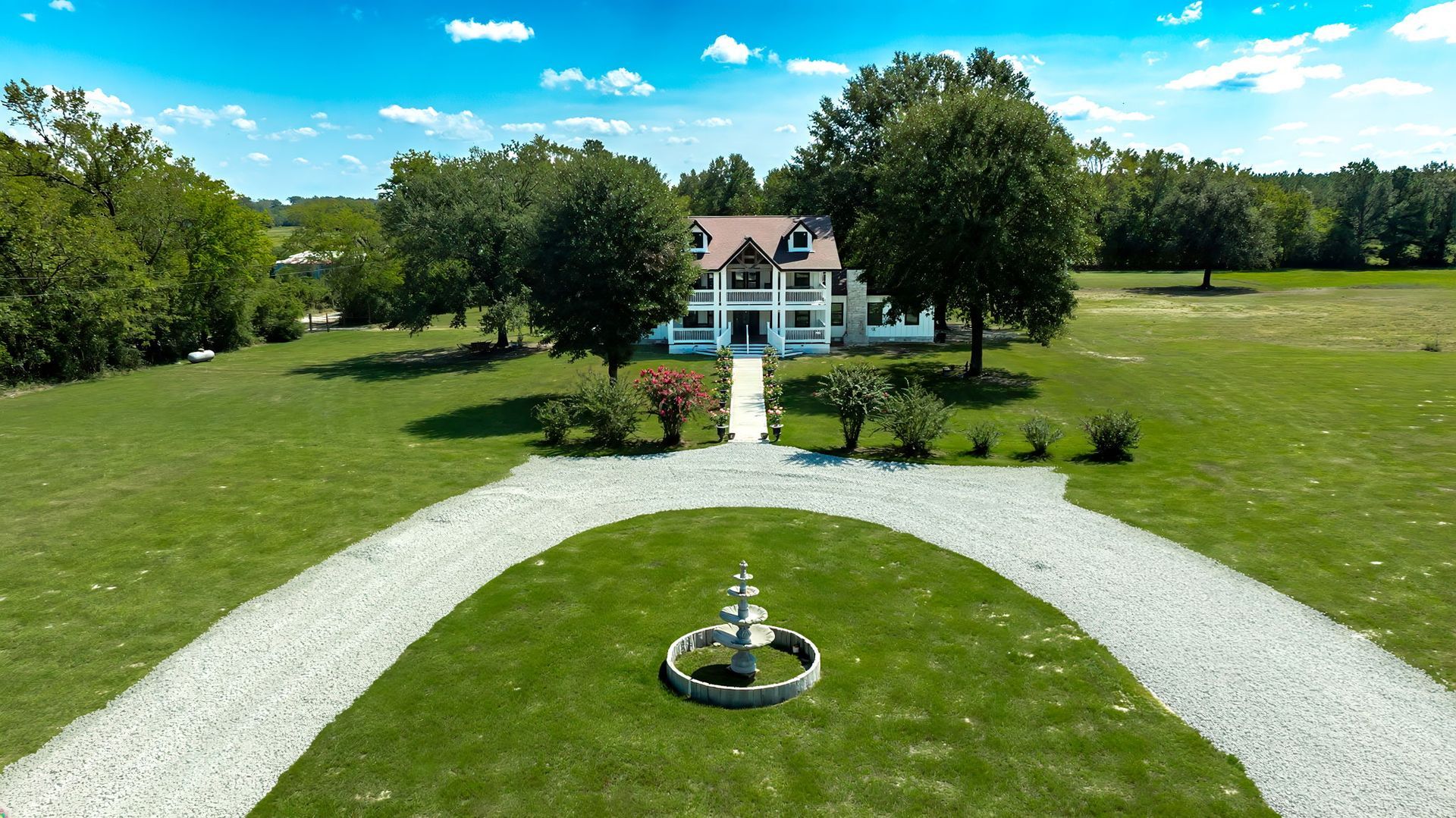 Aerial view of the circular drive and fountain leading to The Greystone Estate
