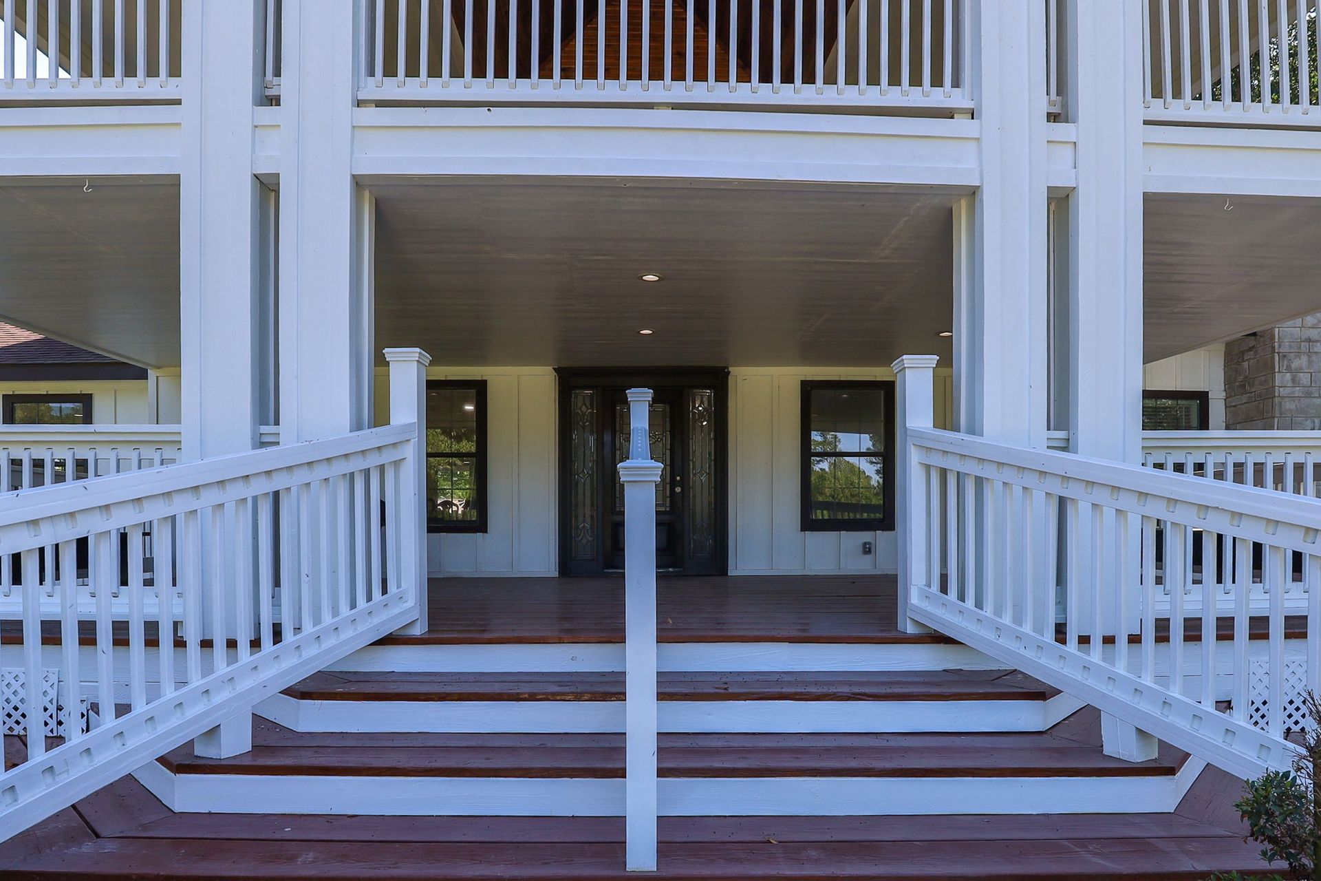 Front steps and double balcony of the farmhouse