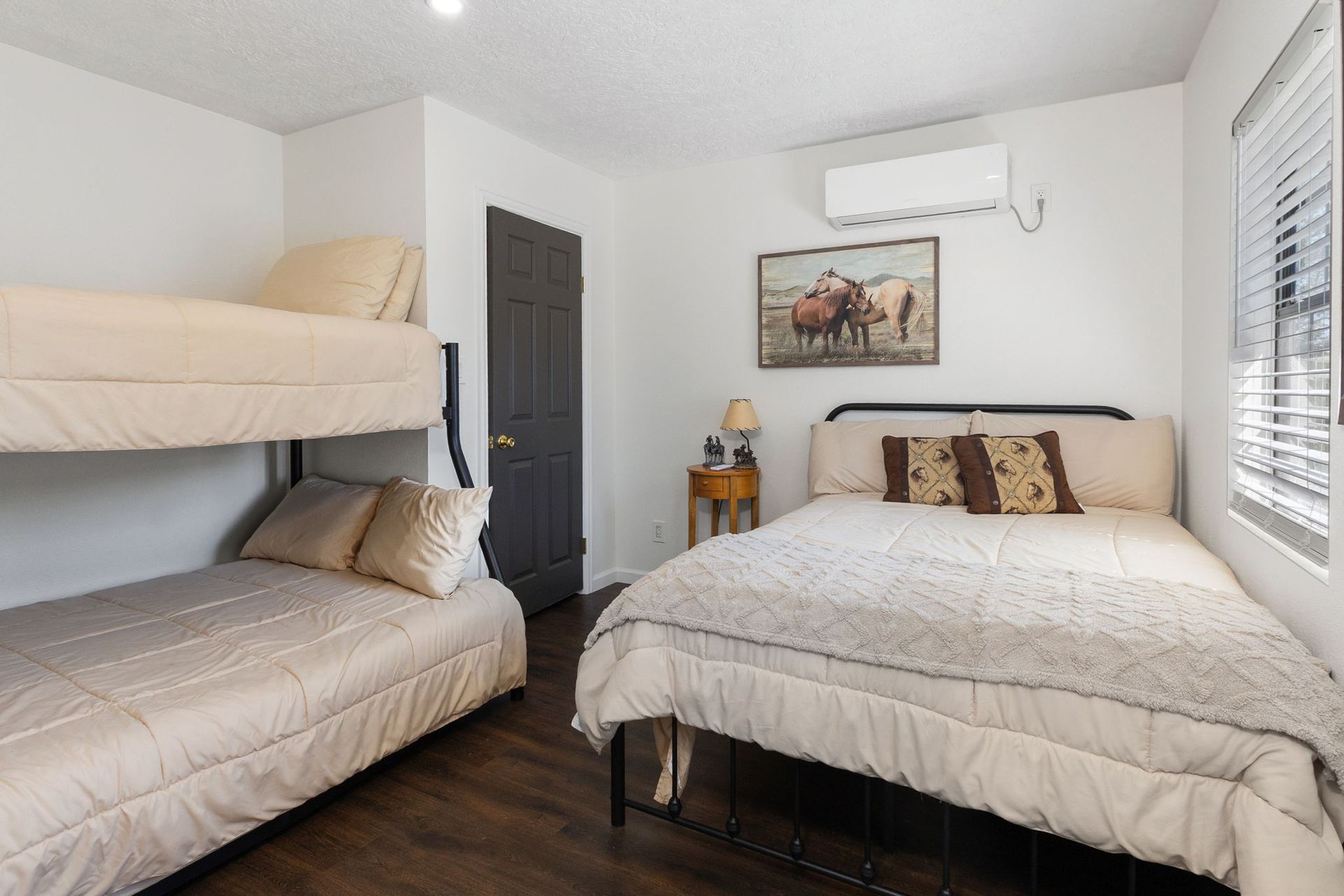 Bunk room with queen bed and bunk beds