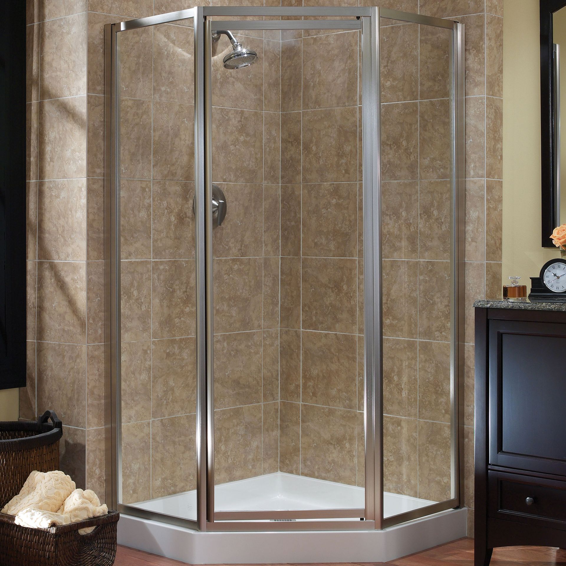 A bathroom with a shower stall and a clock on the wall