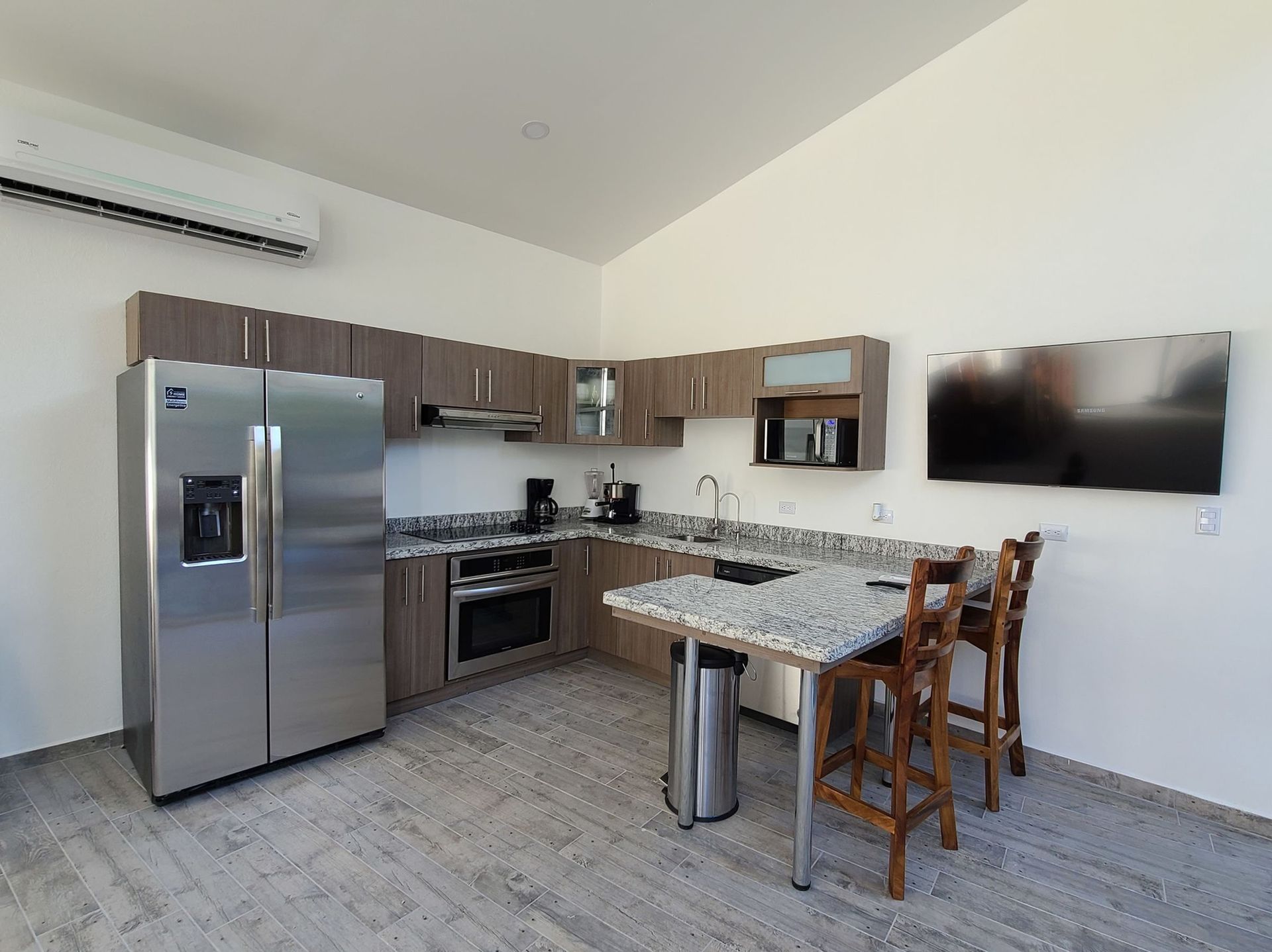 A kitchen with stainless steel appliances and granite counter tops