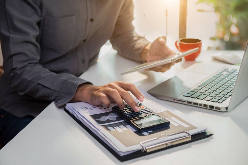 Man Using Calculator