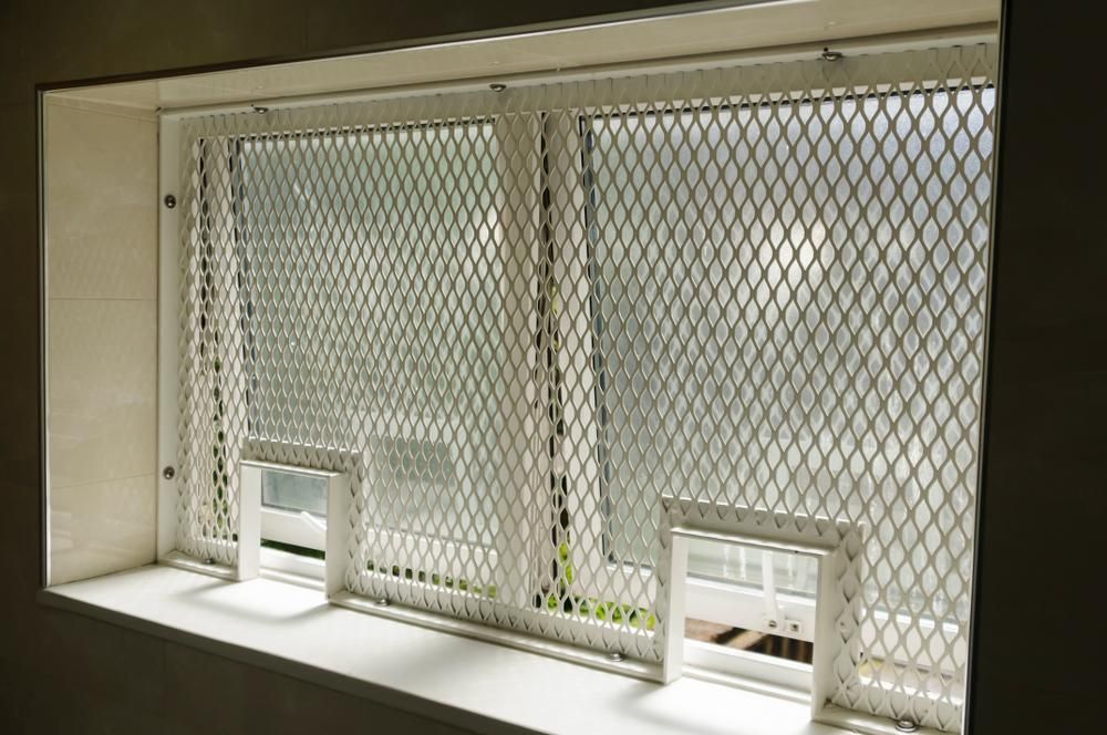 A Window with A Metal Mesh Covering It — K & S Sheetmetal in Gladstone Central, QLD
