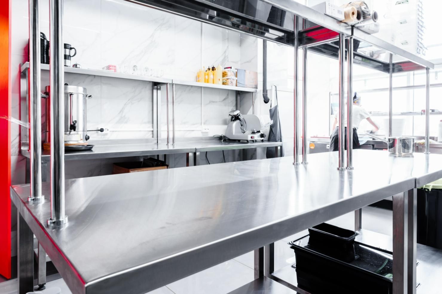 A Kitchen with A Stainless Steel Table and Shelves — K & S Sheetmetal in Gladstone Central, QLD