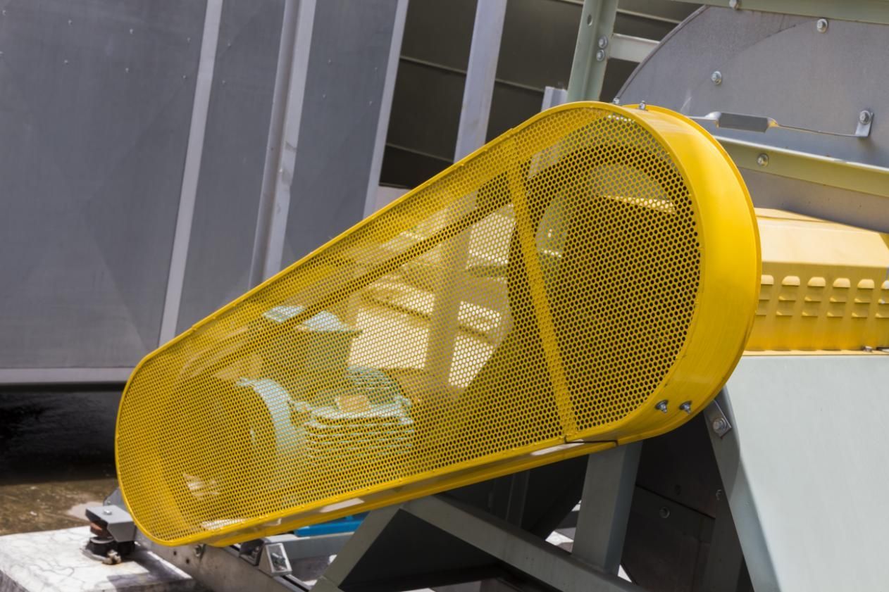 A Close up Of a Yellow Safety Cover on A Machine — K & S Sheetmetal in Tannum Sands, QLD
