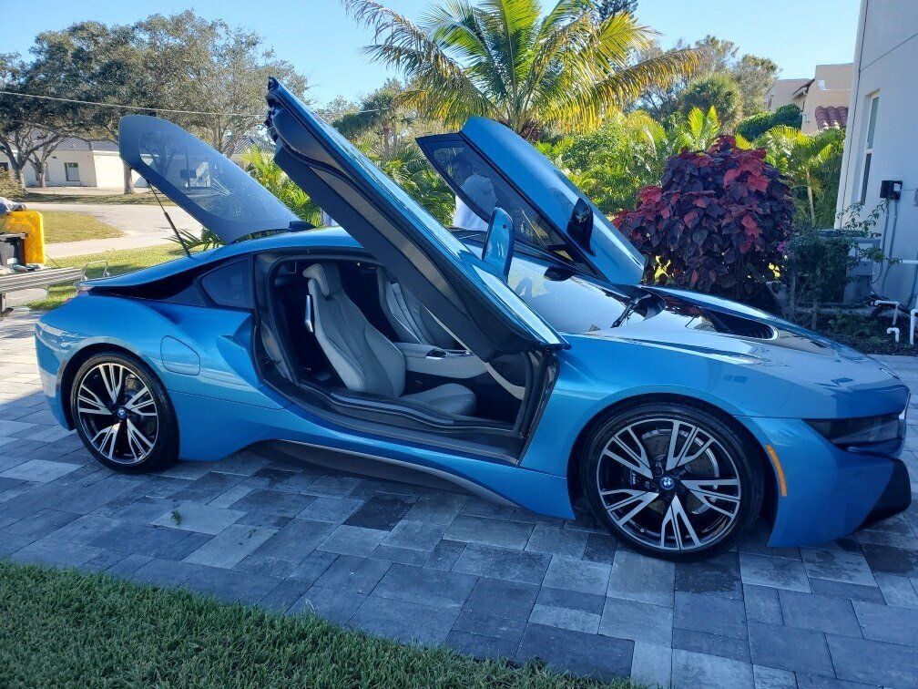 Blue Car With Scissor Doors — Melbourne, Florida — A Absolute Mobile Auto Detailing