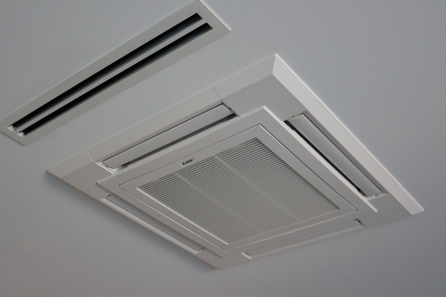 A White Air Conditioner is Hanging From the Ceiling — Chill-Rite Refrigeration and Air Conditioning in Bathurst, NSW