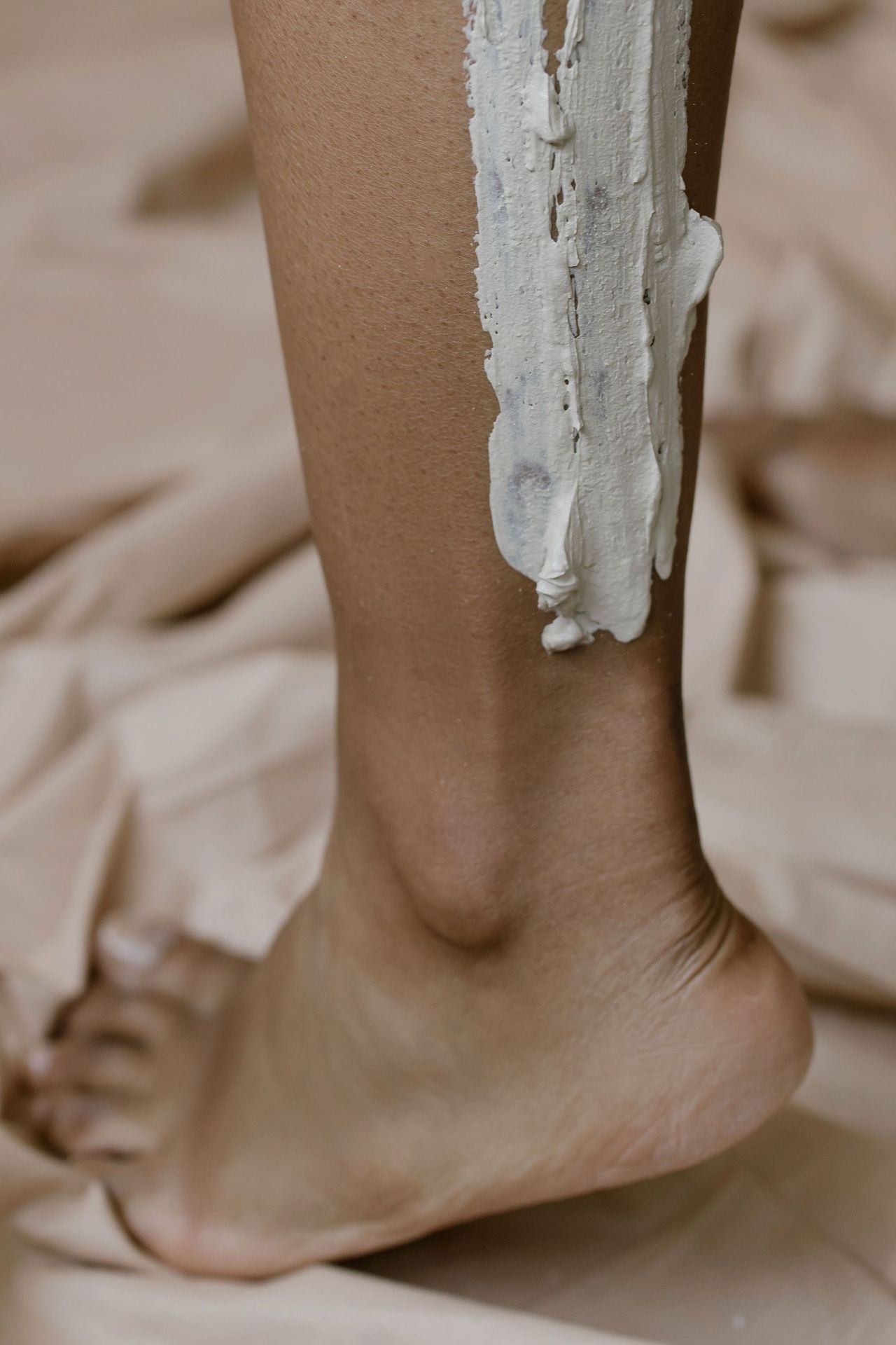Wax applied to the lower leg during a leg wax in Seattle