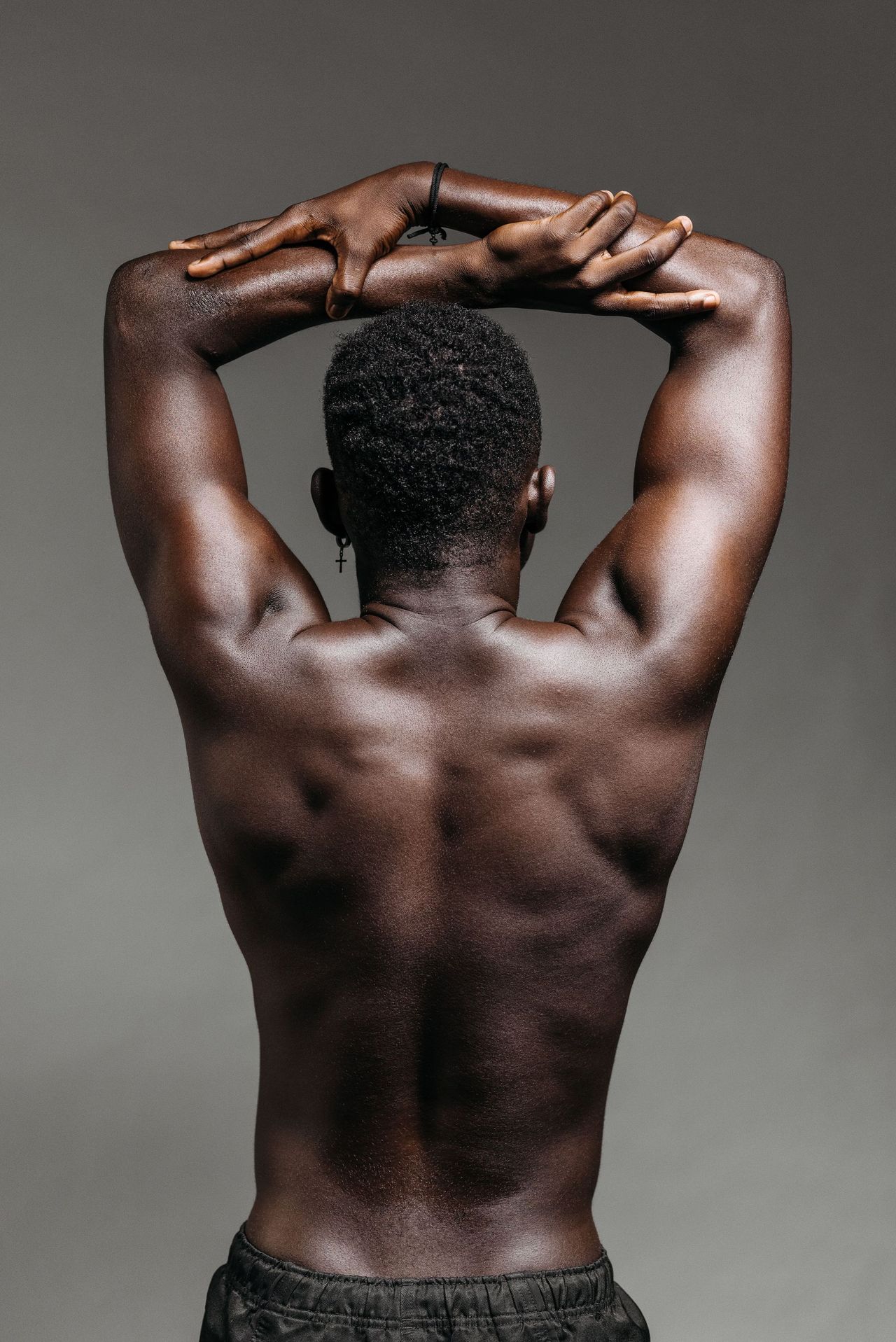Clean upper back and shoulder line after men's waxing in Seattle