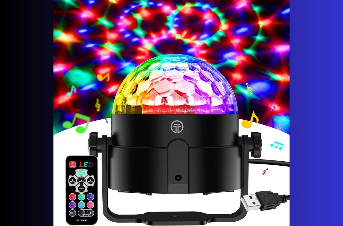 Colorful LED disco light projector with remote, casting multicolor patterns on a wall