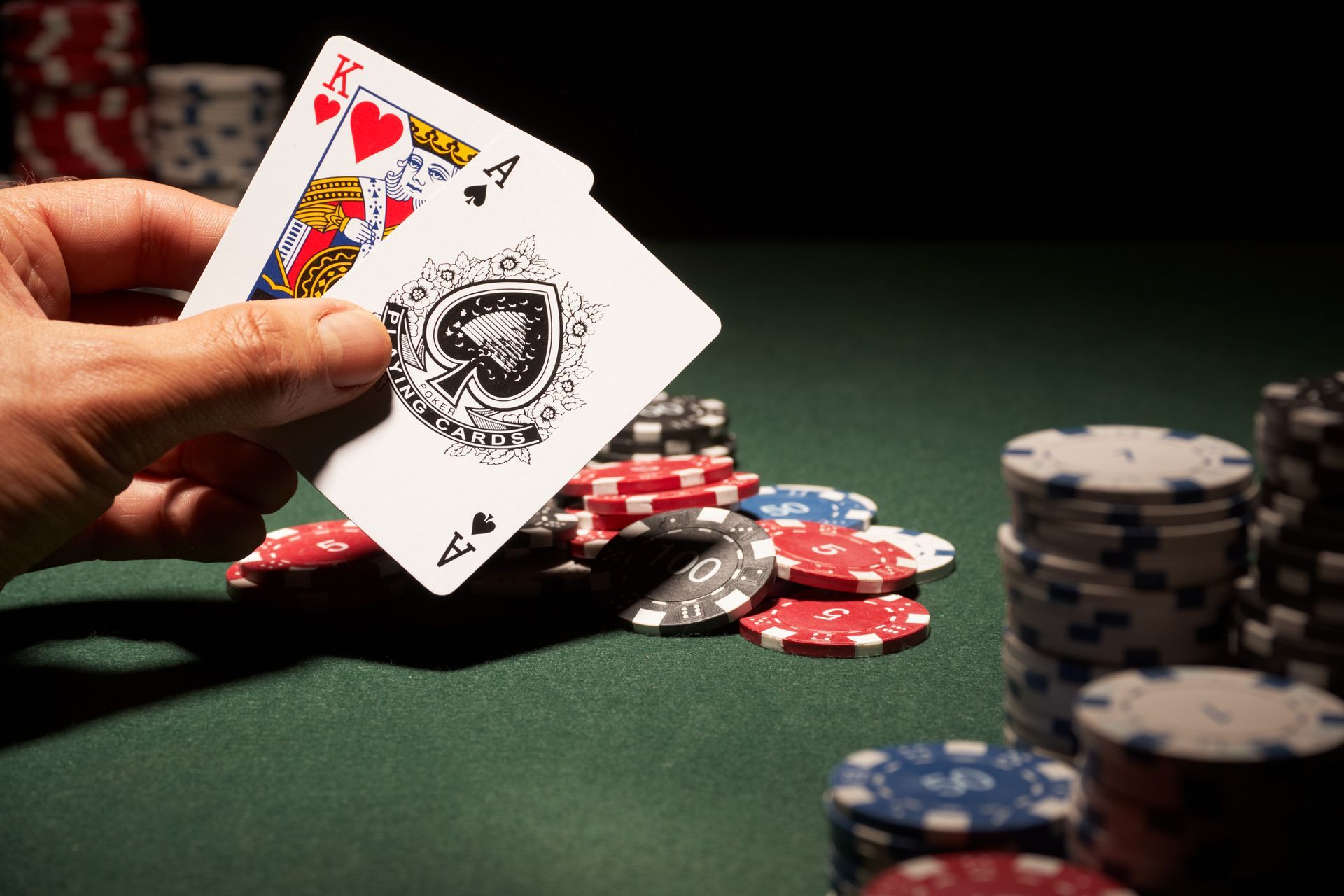 Winning blackjack hand with an ace and king on a green casino table. Winning blackjack hand with an ace and king on a green casino table.