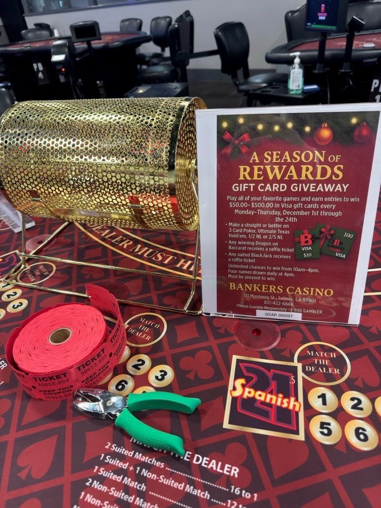 Casino promotional display with a gold raffle drum, red tickets, and a “Season of Rewards” sign on a table.