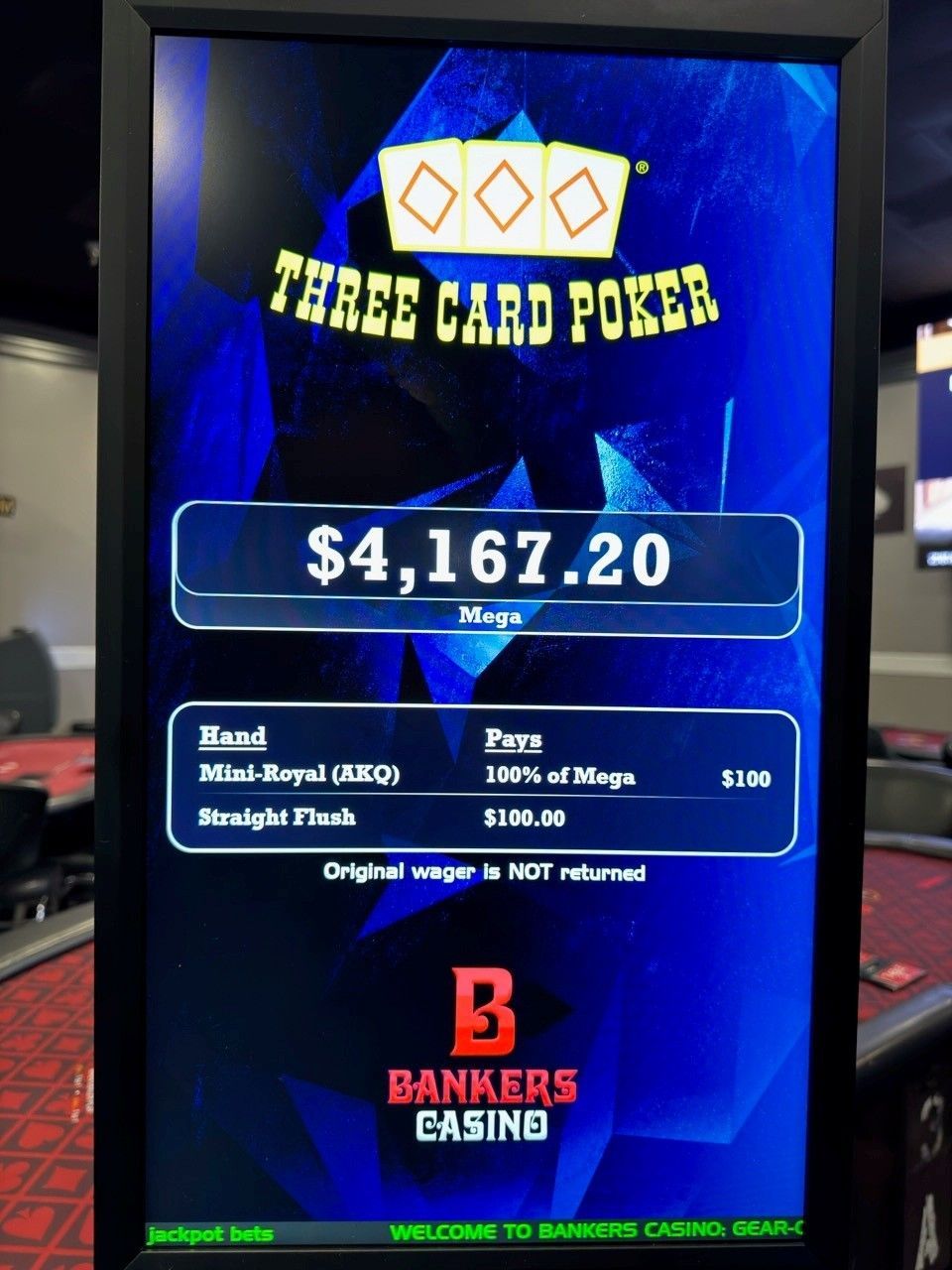 Three Card Poker casino screen showing $4,167.20 jackpot on a blue display.