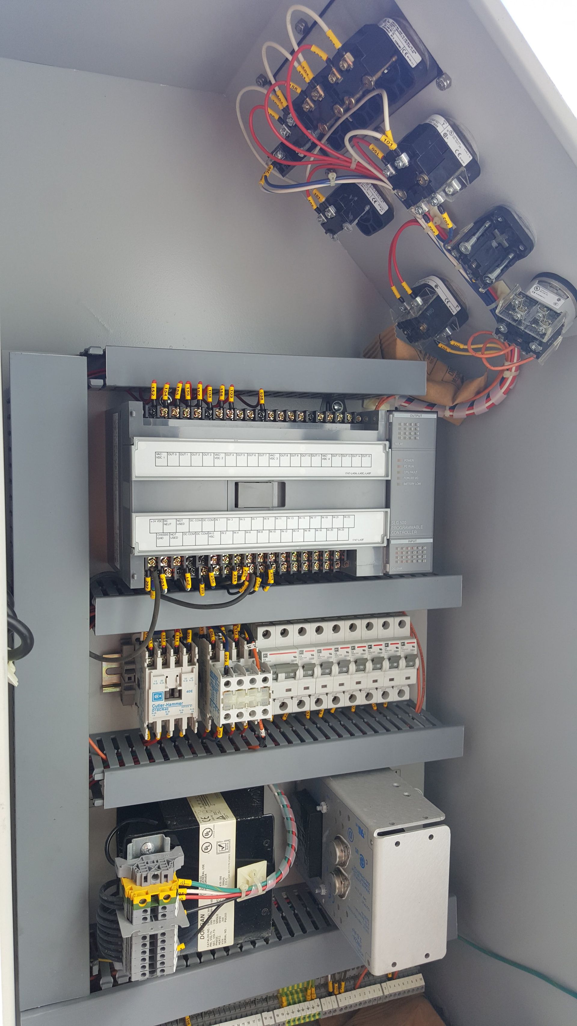 Electrical control panel with various components and wiring.