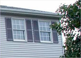 A house with a lot of windows and shutters