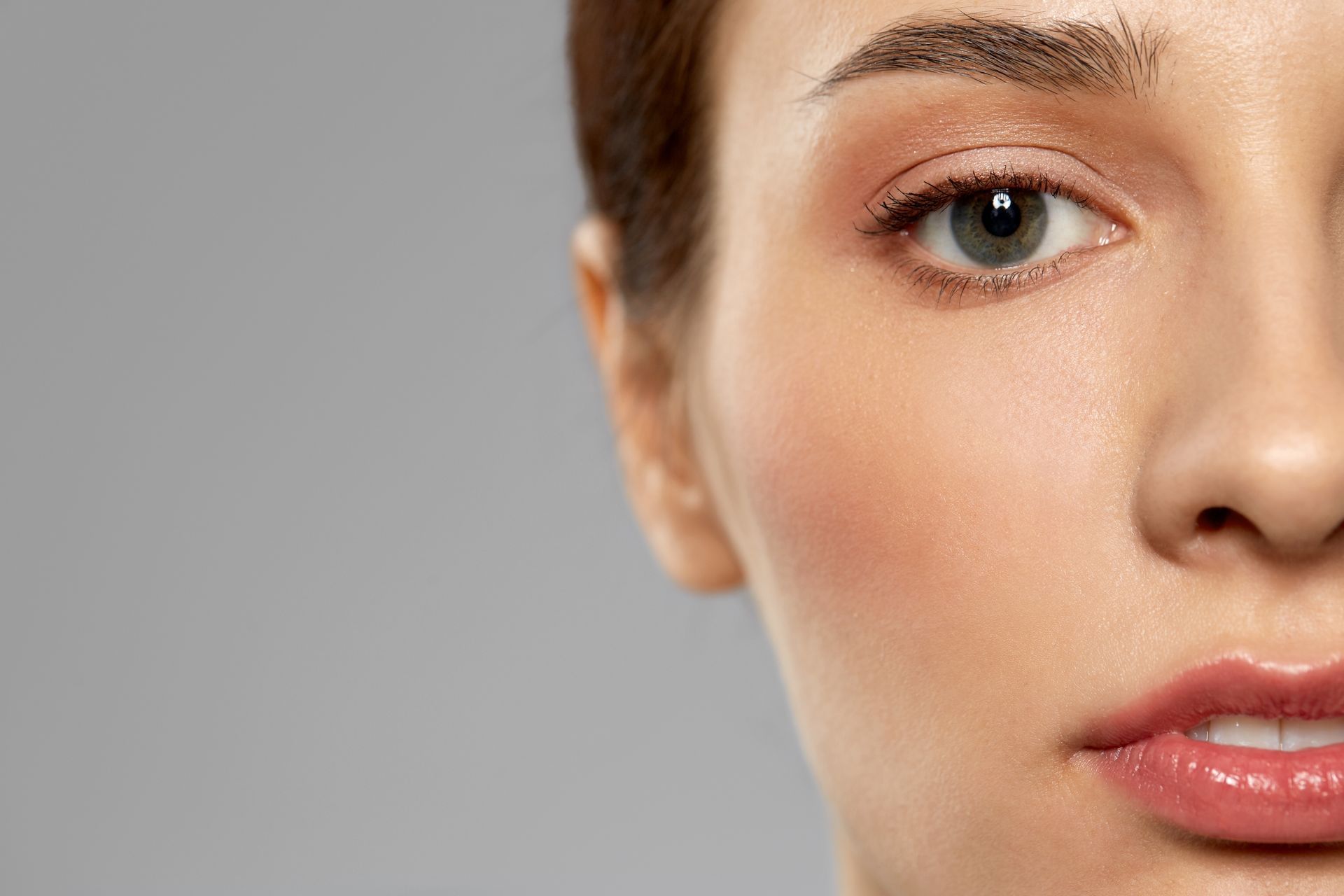 A man with a beard is getting a botox injection in his face. A man with a beard is getting a botox injection in his face.