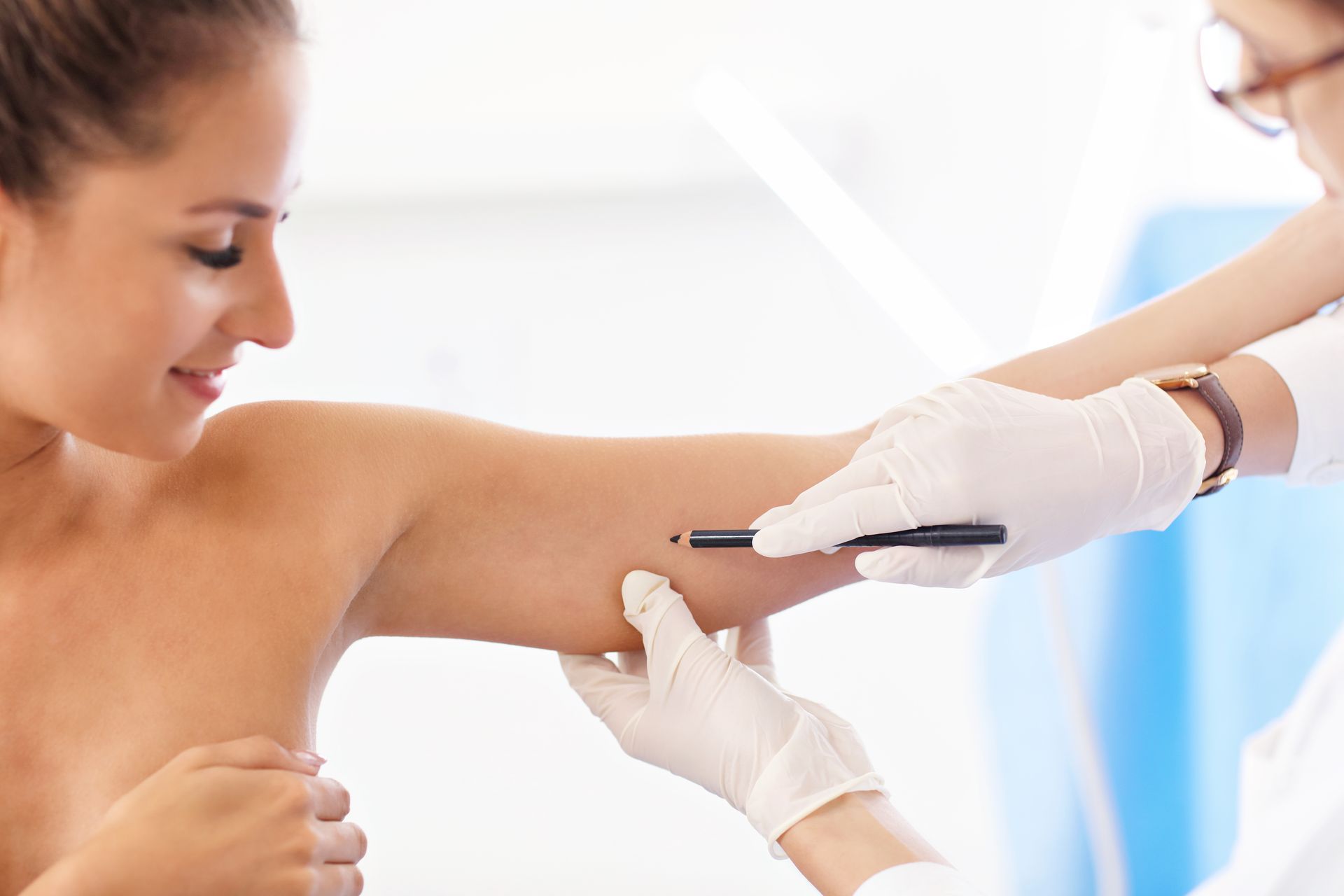 Medical professional administering an injection in a patient’s upper arm