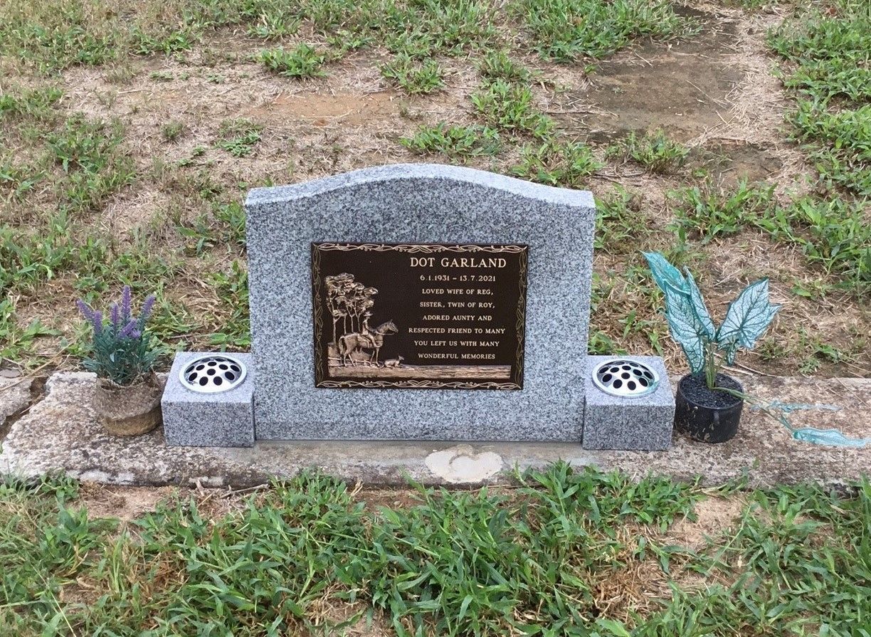 injune light granite with bronze plaque injune light granite with bronze plaque