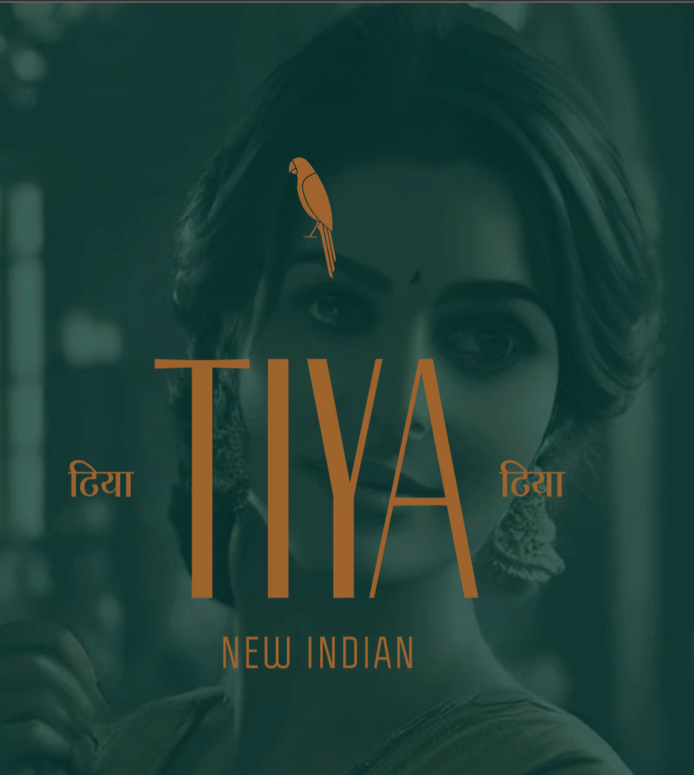 Teal poster with a woman’s face, orange “TIYA” title, and “NEW INDIAN” text