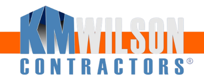 KM Wilson Contractors logo in blue and gray text with a stylized KM monogram