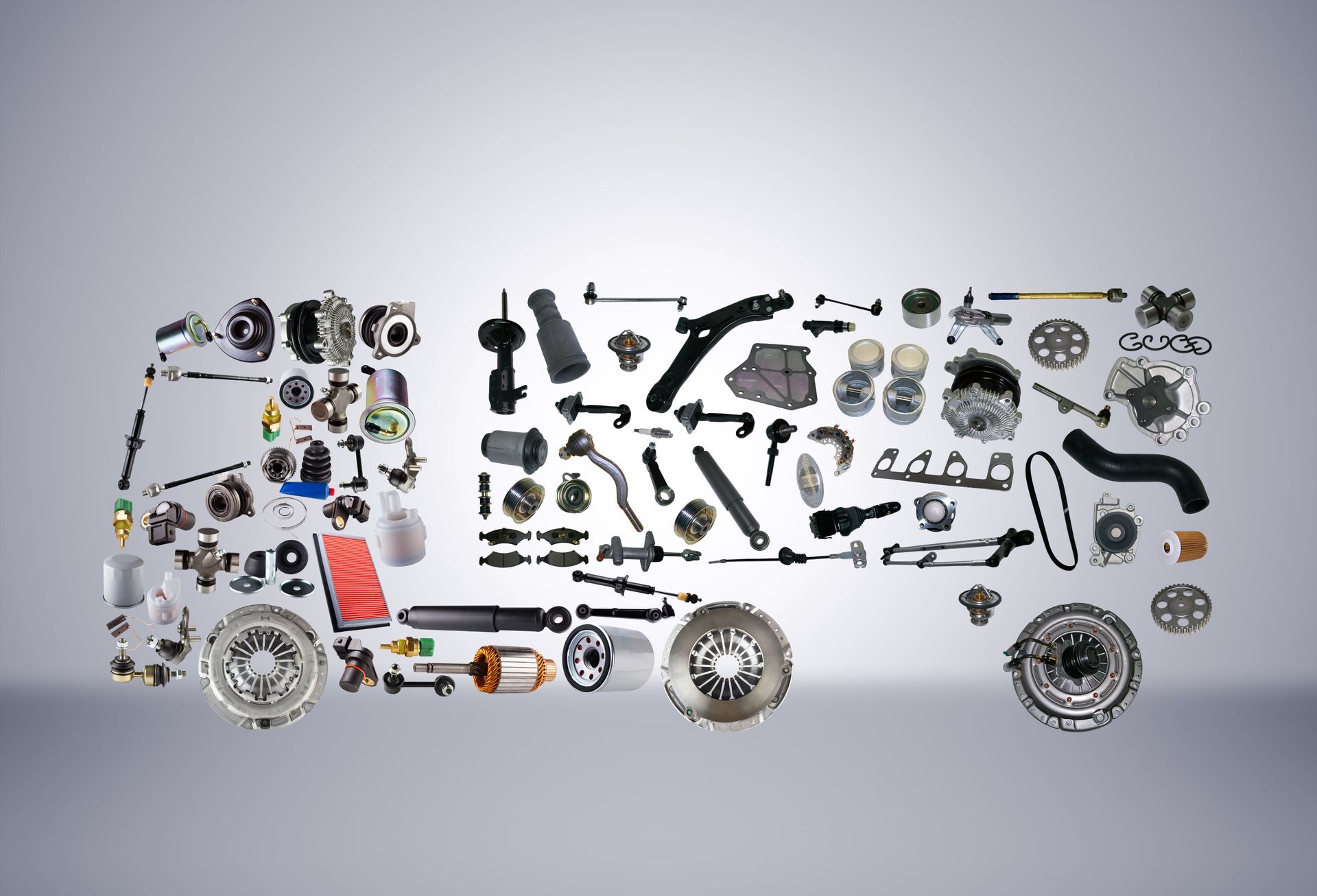 A truck assembled from new spare parts on a grey background.