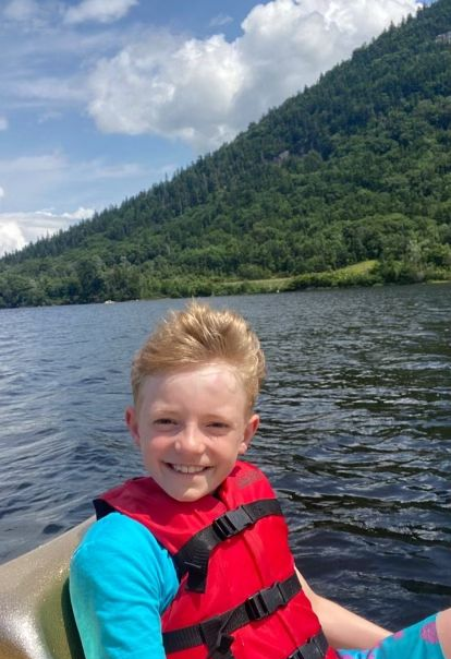 child in a life jacket at echo lake beach