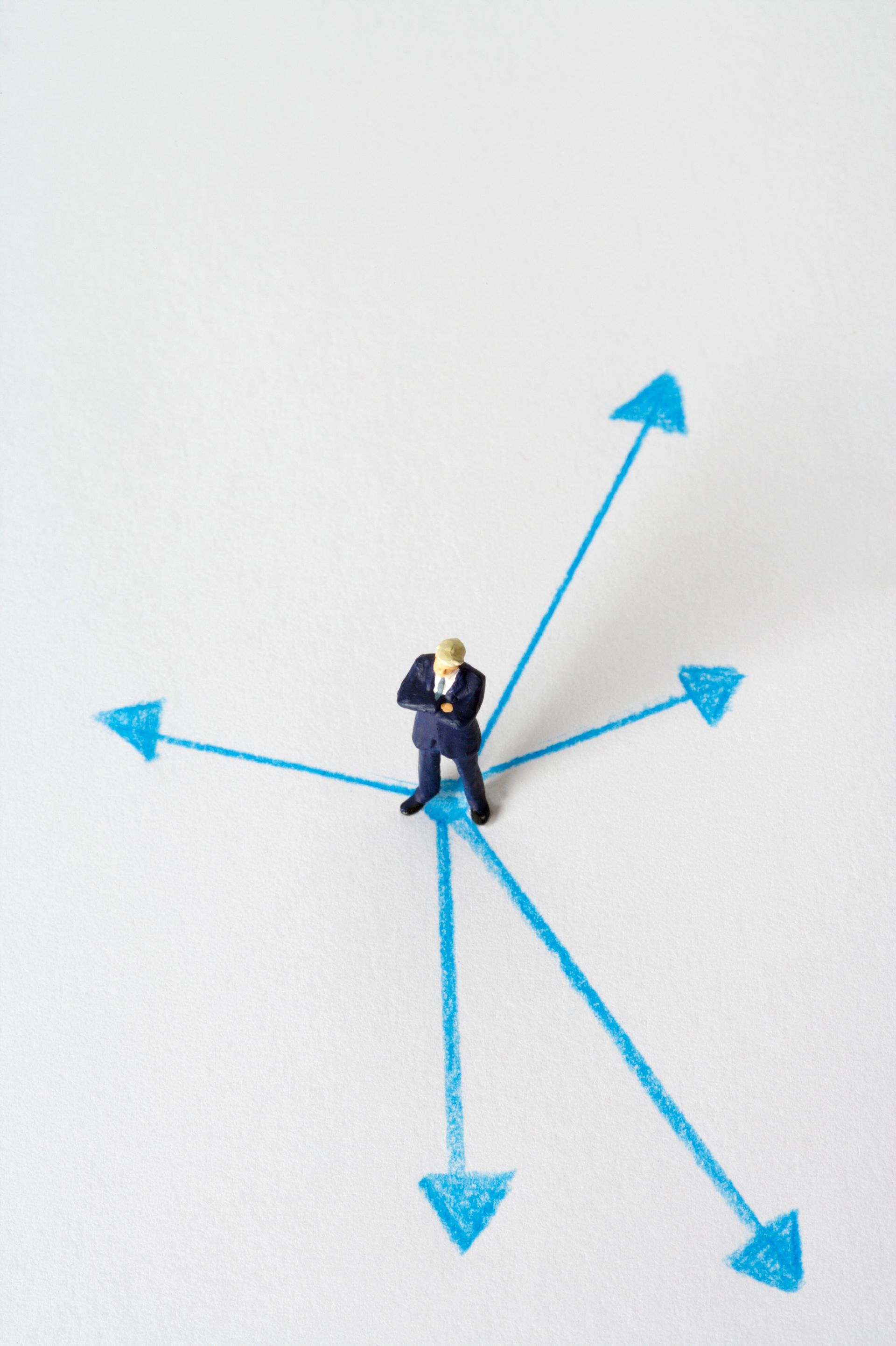 A person standing at a crossroads, representing a career decision point