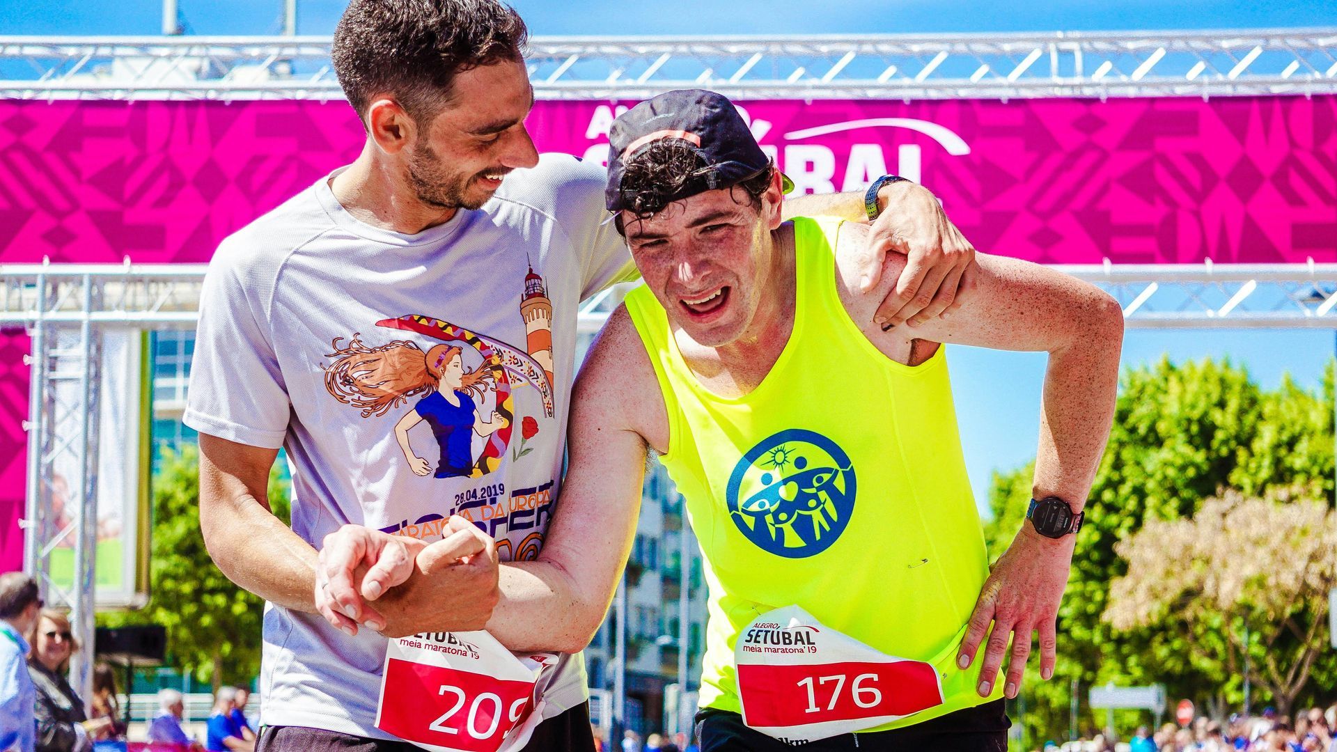 Marathon runners helping each other.