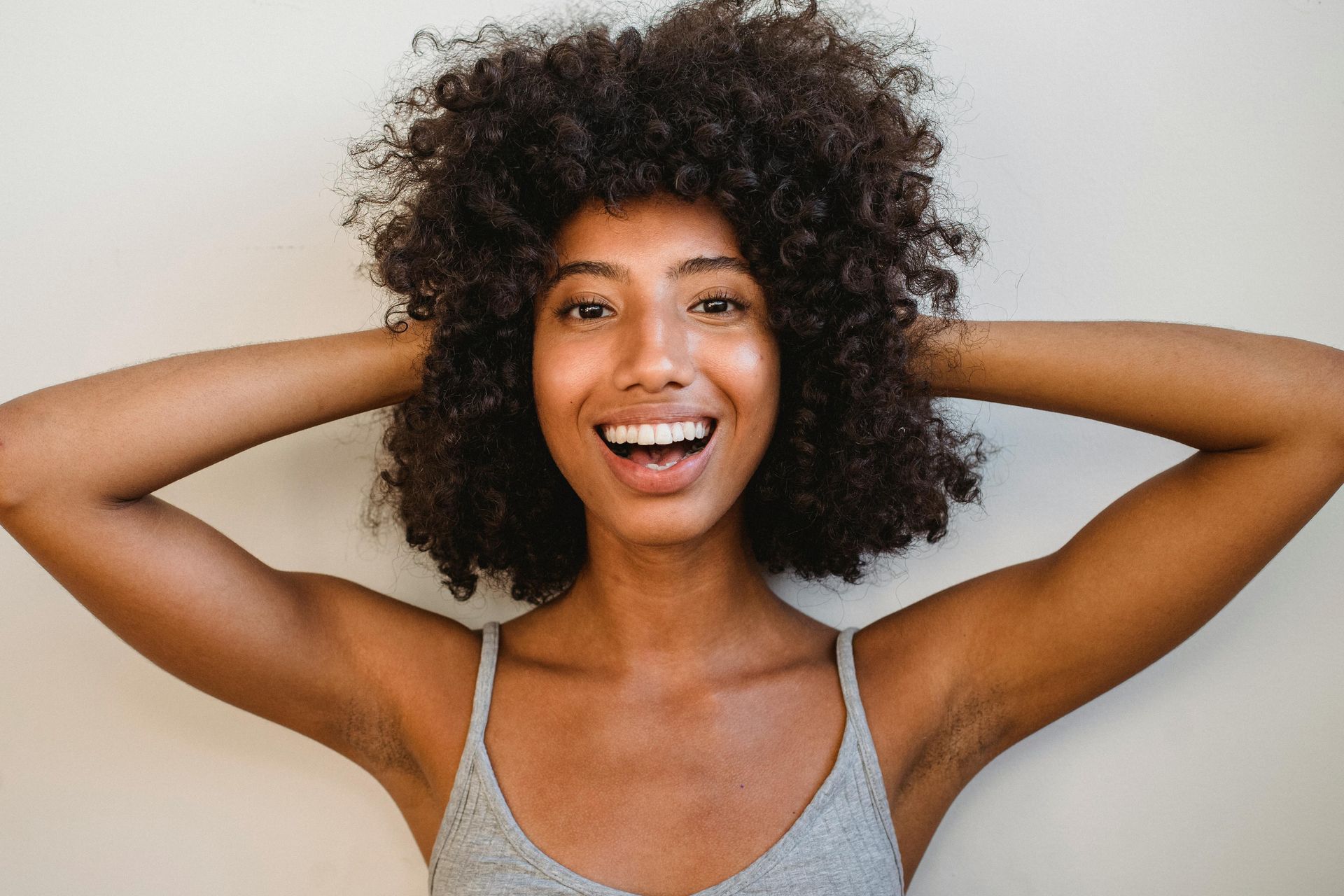 woman with an astonished smile.