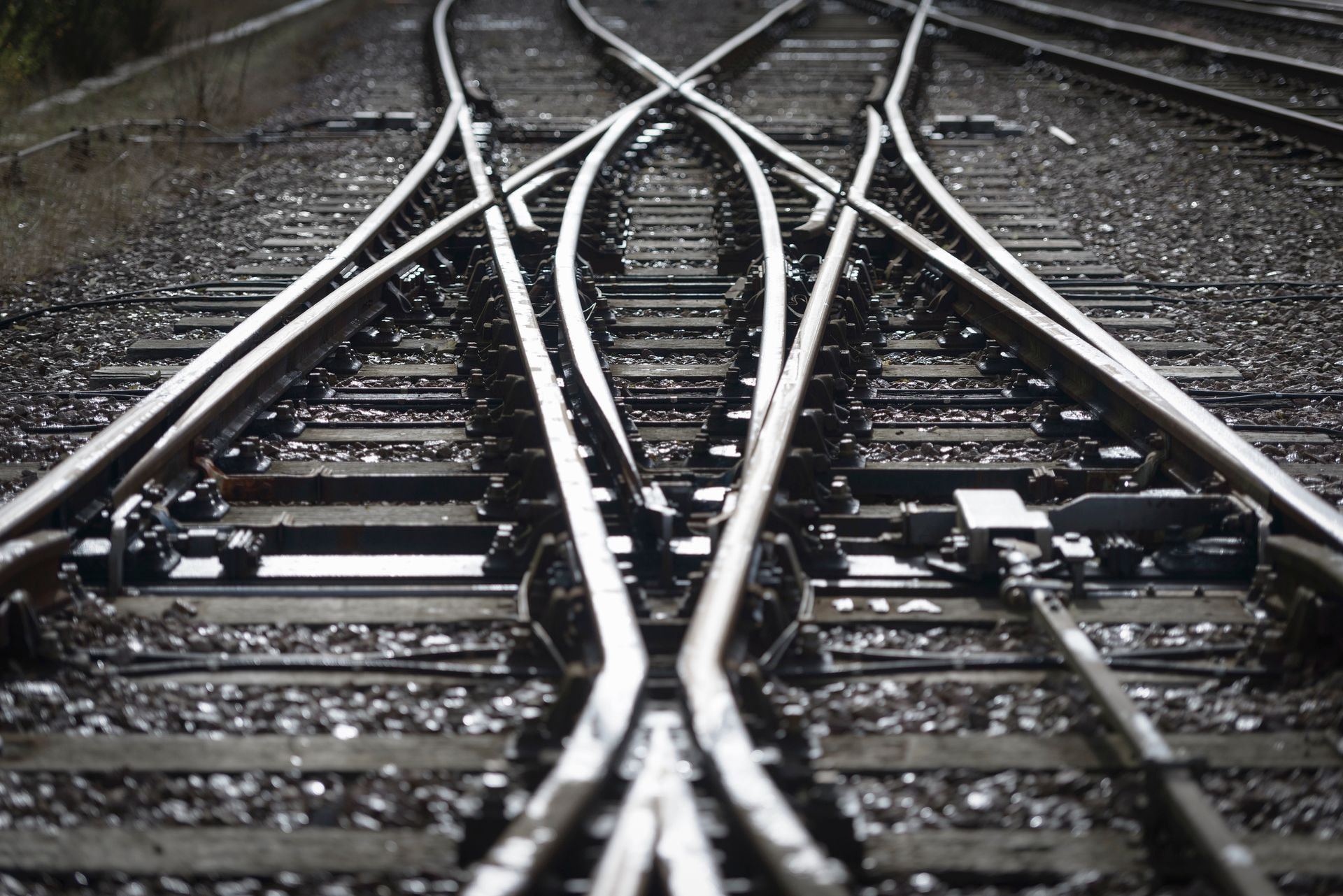 A black and white photo of a train track