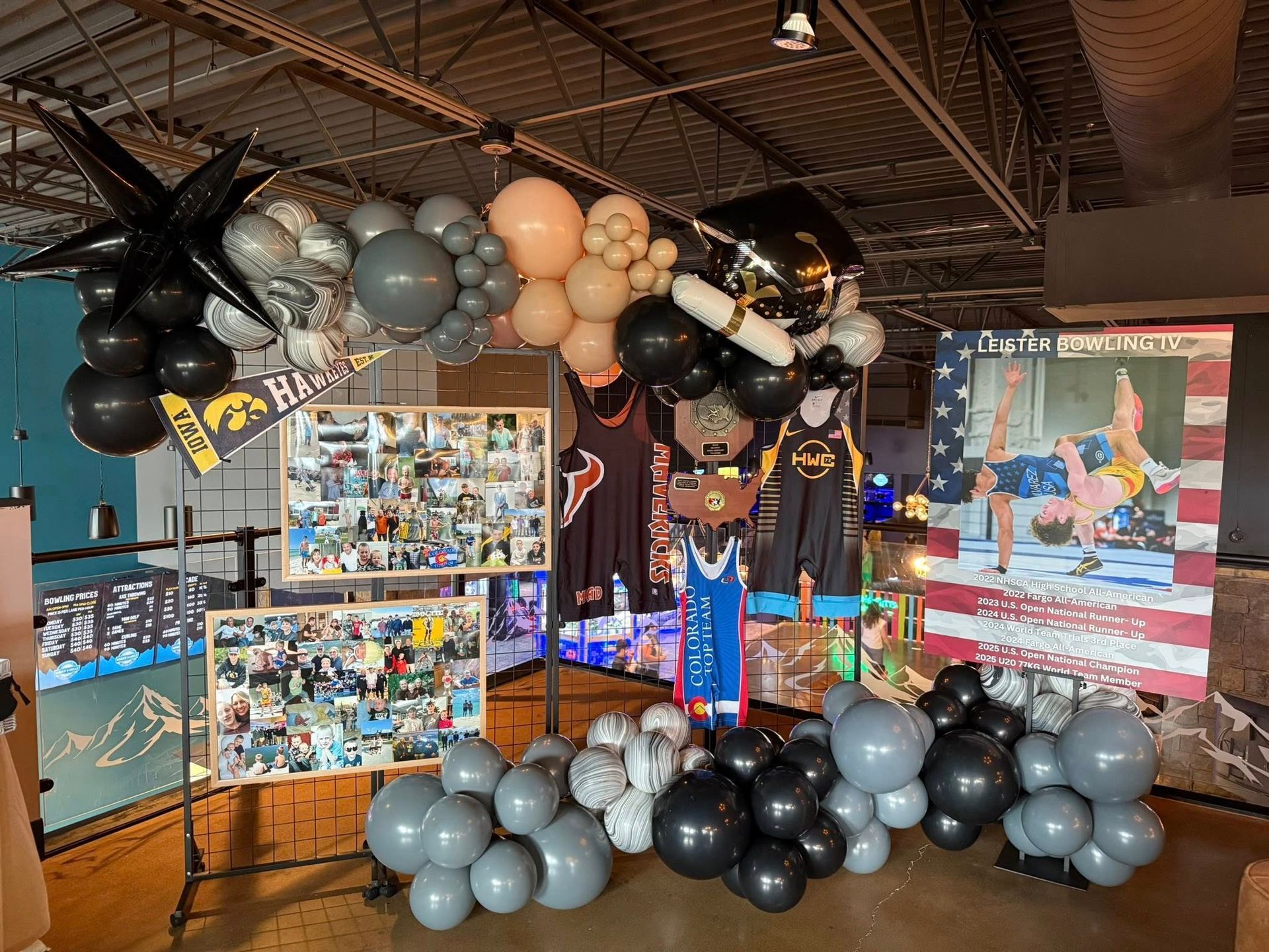 A bunch of balloons are hanging from the ceiling in a room.