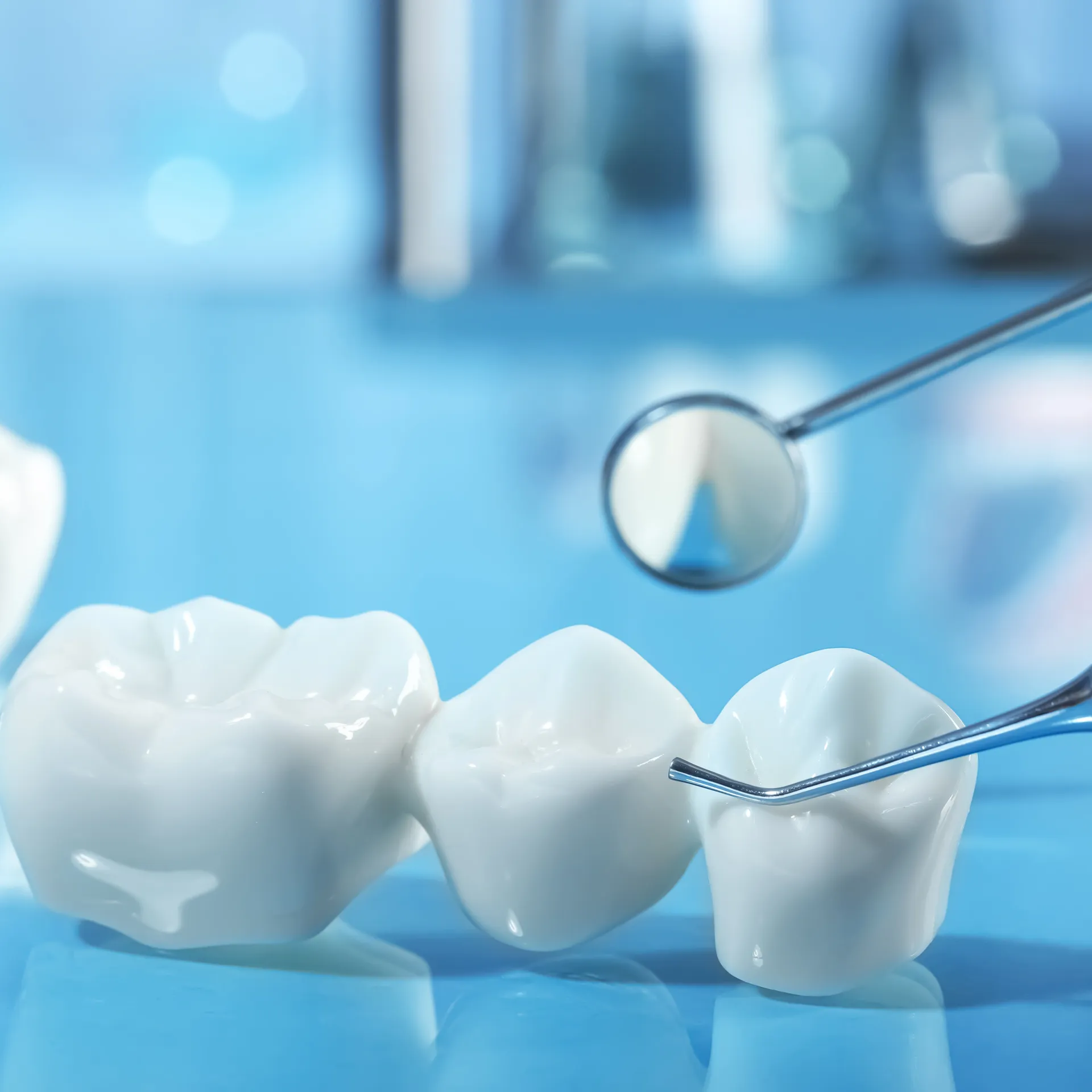 image of porcelain crowns with medical tool